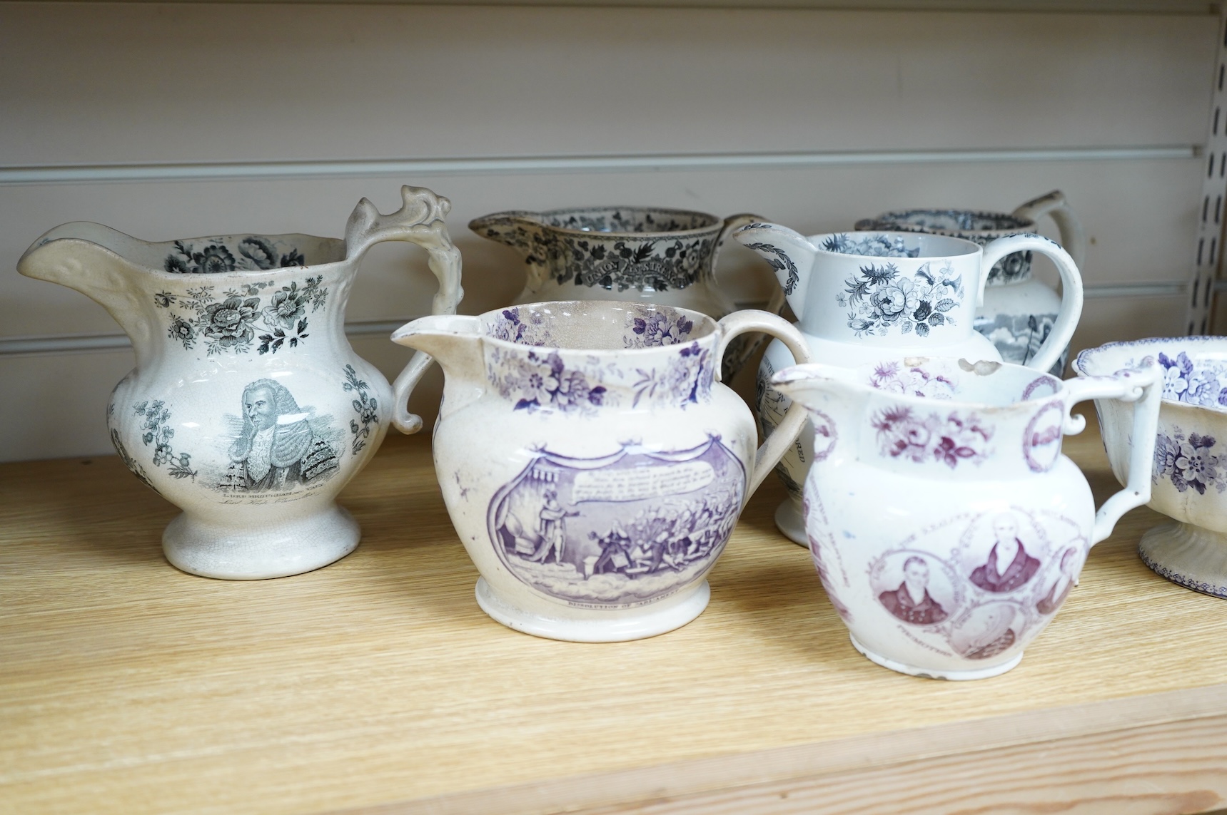 Six contemporary political themed earthenware pottery jugs and a pedestal bowl commemorating the 1832 Reform Bill, with transfer printed symbolic scenes of the Houses of Parliament, details regarding the voting, portrait